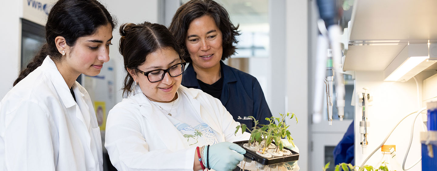 student and faculty in biology lab